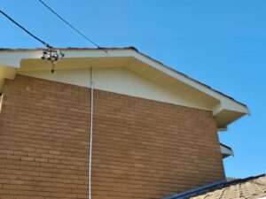 Professional plumber installing water heater in Canberra home bathroom with modern fixtures and quality plumbing tools